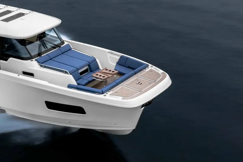 Slide: The Image of 2026 Aiata Sunfinder 50 yacht with sleek design and spacious seating on calm waters. - 17