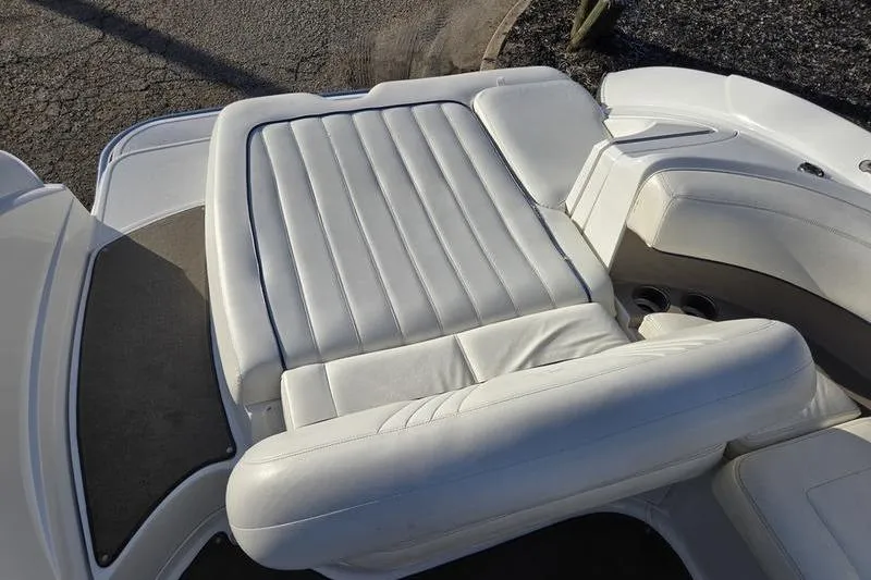 Slide: The Image of 2006 Cobalt 232 boat with white leather seating and sleek design. - 7