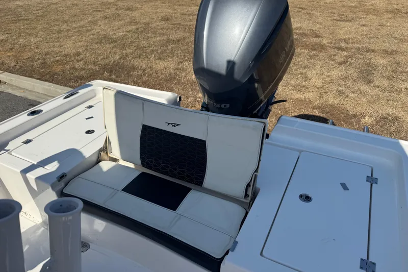 Slide: The Image of 2024 Tidewater 2410 Bay Max boat with Yamaha engine, featuring comfortable seating. - 13