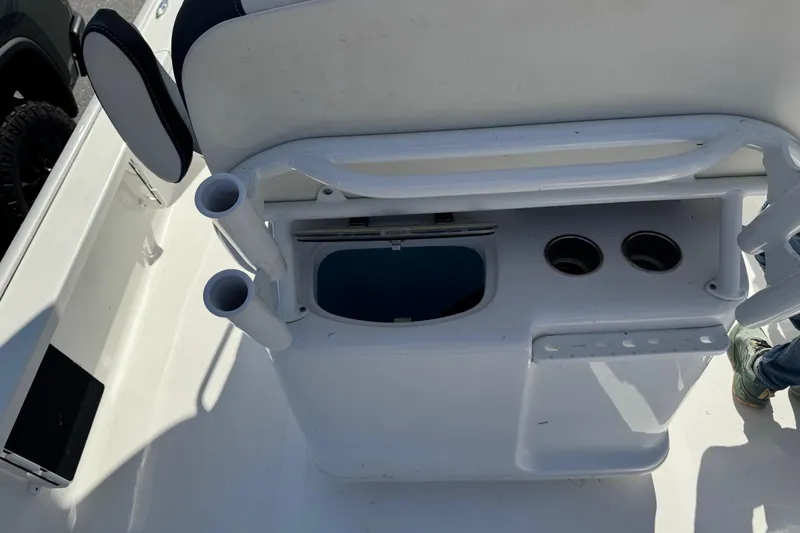 Slide: The Image of 2024 Tidewater 2410 Bay Max boat interior with rod holders and storage compartments. - 14