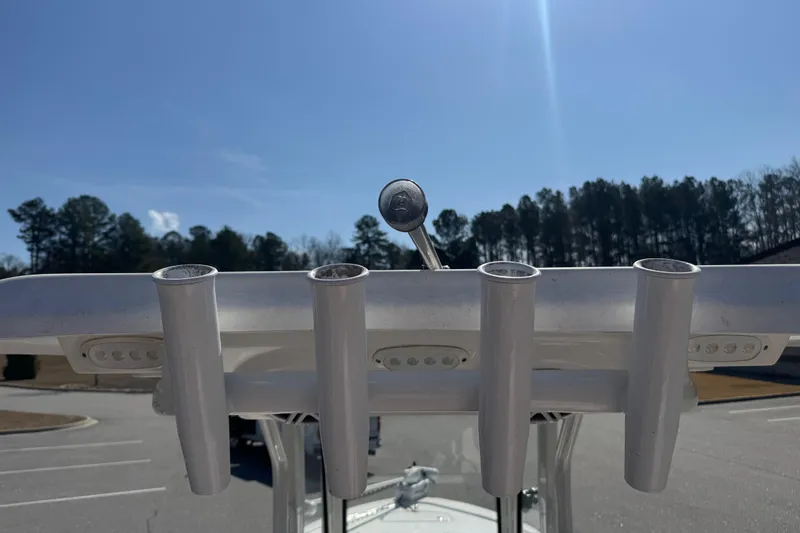 Slide: The Image of 2024 Tidewater 2410 Bay Max boat rod holders under clear blue sky. - 15