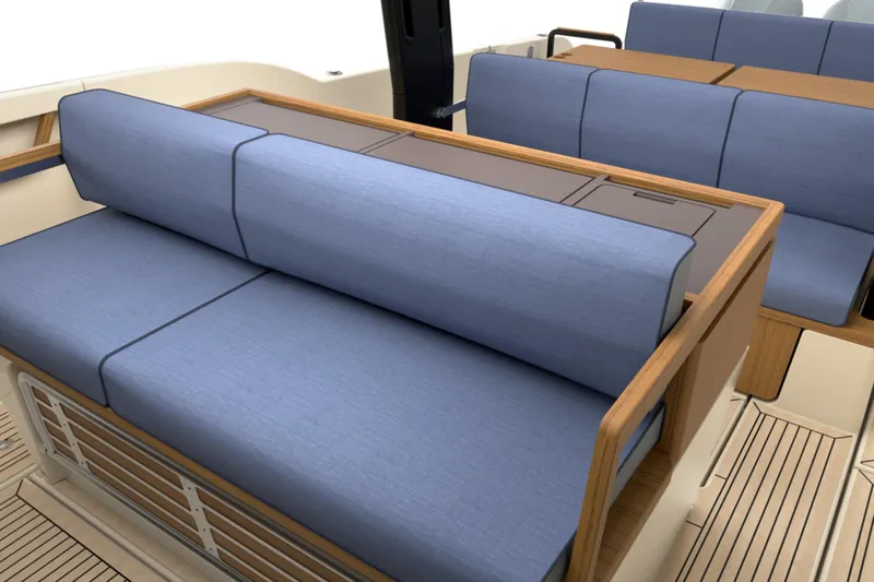Slide: The Image of Luxurious seating on 2026 Aiata Sunfinder 38 yacht with blue cushions and wooden accents. - 7