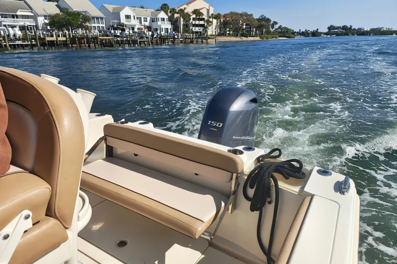 Slide: The Image of 2020 Scout 215 XSF boat with Yamaha 150 engine on a sunny day. - 7