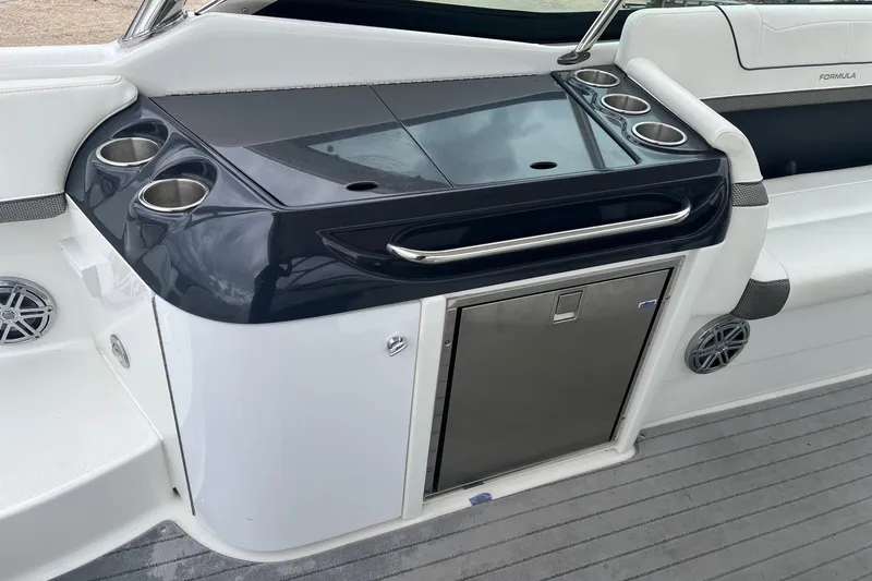 Slide: The Image of 2017 Formula 350 Crossover Bowrider interior with sleek wet bar and cup holders. - 10