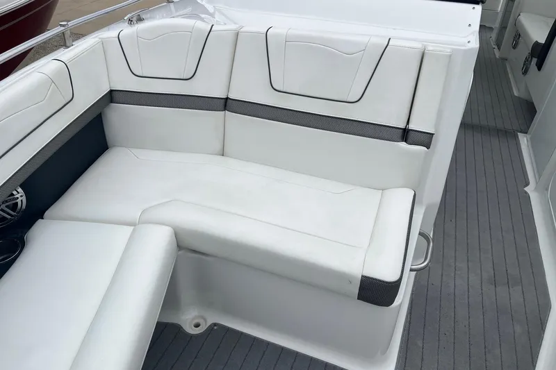 Slide: The Image of 2017 Formula 350 Crossover Bowrider interior seating with white upholstery and gray accents. - 16