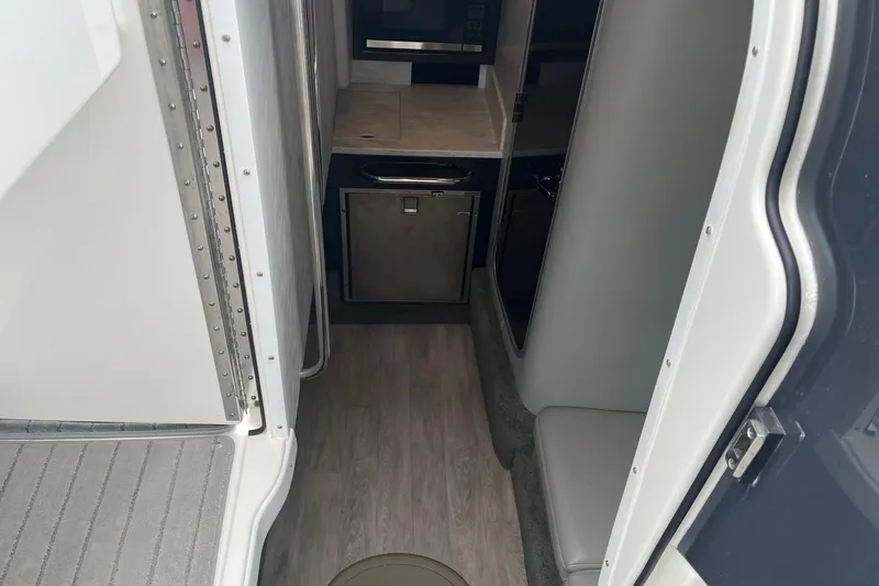 Slide: The Image of Interior view of 2017 Formula 350 Crossover Bowrider, featuring compact cabin amenities. - 19