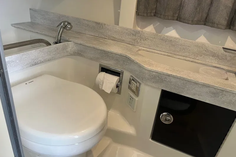 Slide: The Image of 2017 Formula 350 Crossover Bowrider bathroom with modern fixtures and sleek design. - 22