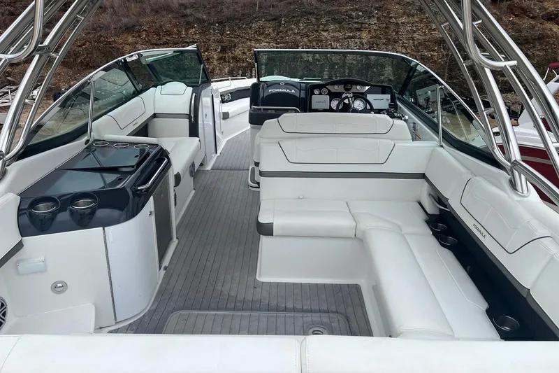 Slide: The Image of 2017 Formula 350 Crossover Bowrider interior with white seating and sleek design. - 6