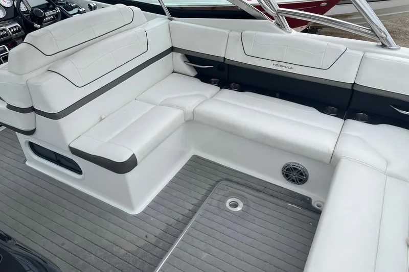 Slide: The Image of 2017 Formula 350 Crossover Bowrider interior with white seating and sleek design. - 7