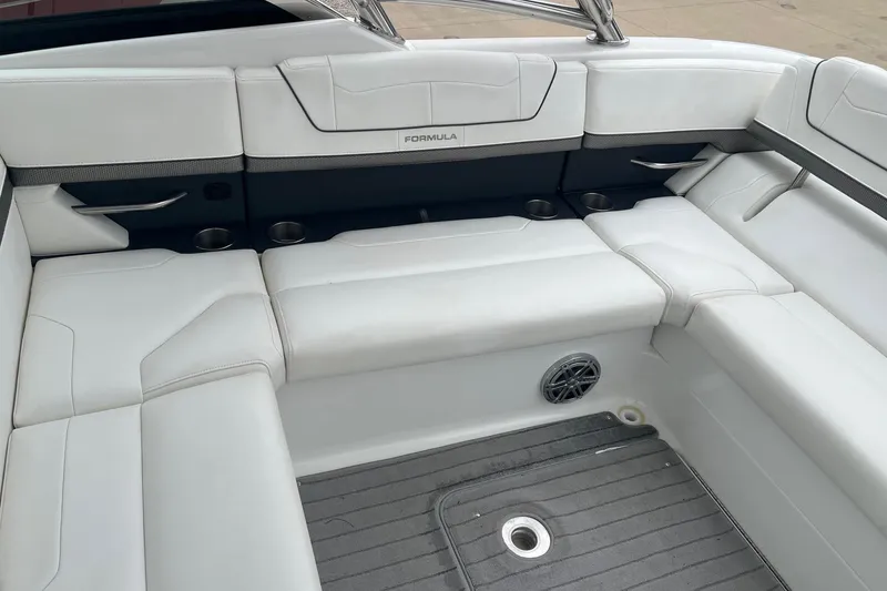 Slide: The Image of 2017 Formula 350 Crossover Bowrider interior with white seating and cup holders. - 8