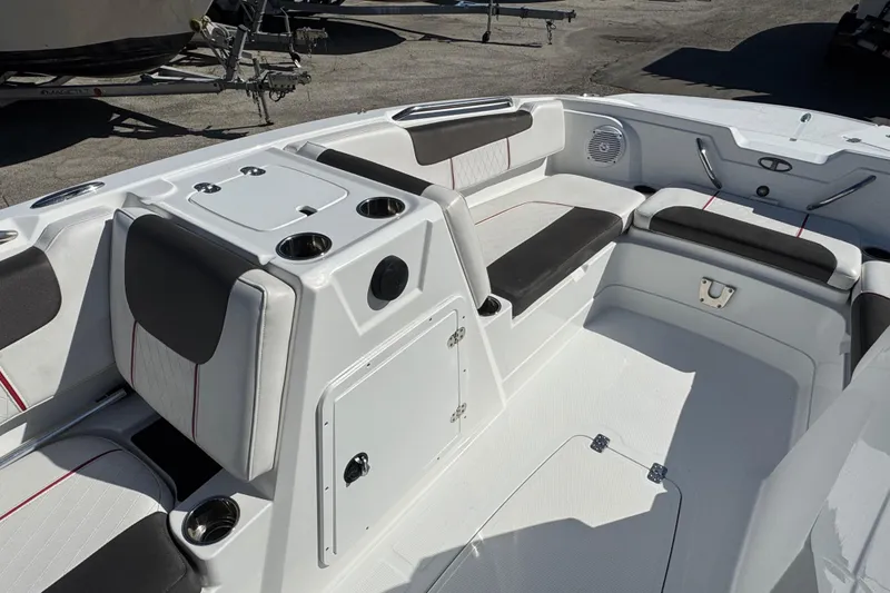 Slide: The Image of Interior of a 2023 Tahoe 1950 boat with seating and storage compartments. - 14