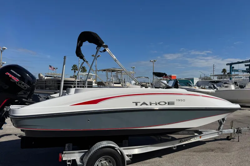 Slide: The Image of 2023 Tahoe 1950 boat on trailer, featuring sleek design and Mercury Pro XS engine. - 3
