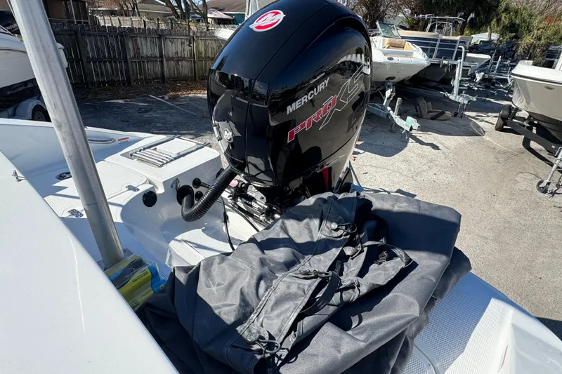 Slide: The Image of Boat with Mercury Pro XS engine, Tahoe 1950 model, 2023, in a marina setting. - 7