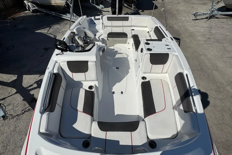 Slide: The Image of 2023 Tahoe 1950 boat interior with spacious seating and modern design. - 9