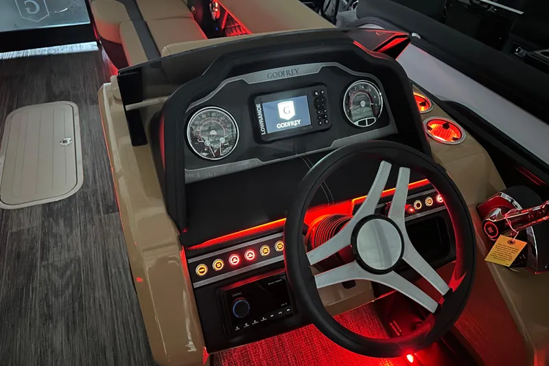 Slide: The Image of Luxurious seating in 2026 Godfrey Monaco 255 SB boat with ambient lighting and cup holders. - 10