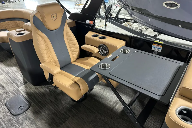 Slide: The Image of 2026 Godfrey Monaco 255 SB pontoon boat with red LED lights in a showroom. - 12