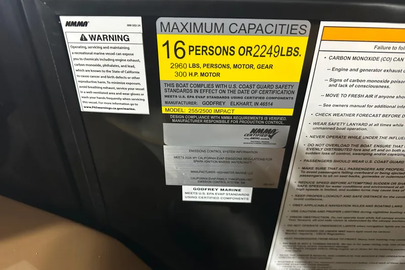Slide: The Image of 2026 Godfrey Monaco 255 SB interior with luxurious tan and gray seating. - 14
