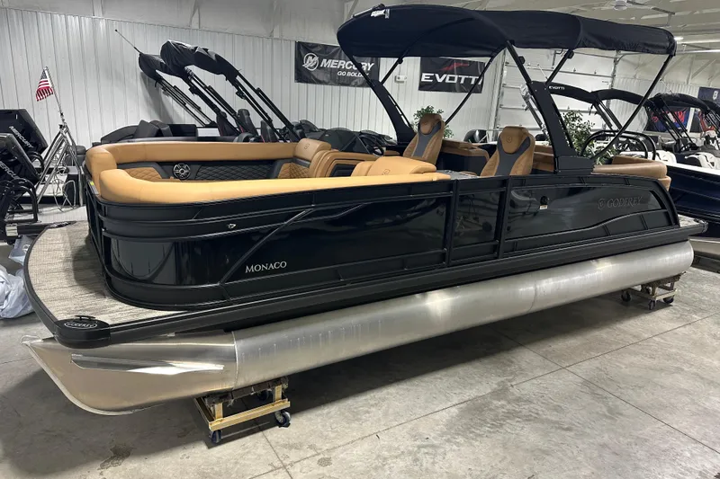 Slide: The Image of Luxurious interior of 2026 Godfrey Monaco 255 SB boat with tan seating and modern dashboard. - 16