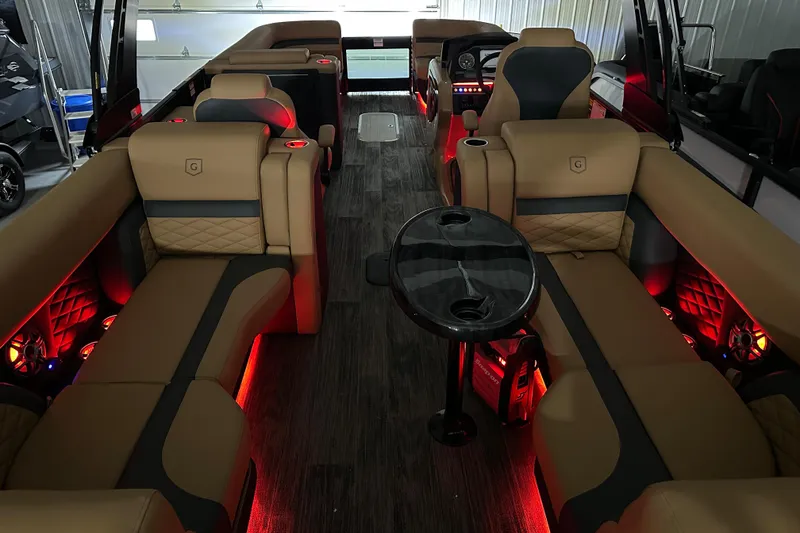 Slide: The Image of Luxurious interior of 2026 Godfrey Monaco 255 SB pontoon boat with ambient red lighting. - 5