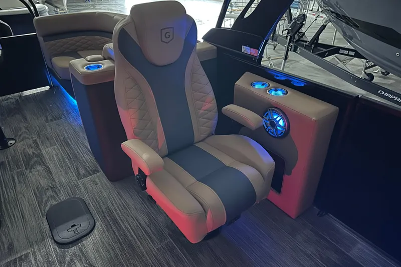 Slide: The Image of 2026 Godfrey Monaco 255 SB pontoon boat with purple LED lights in showroom. - 9