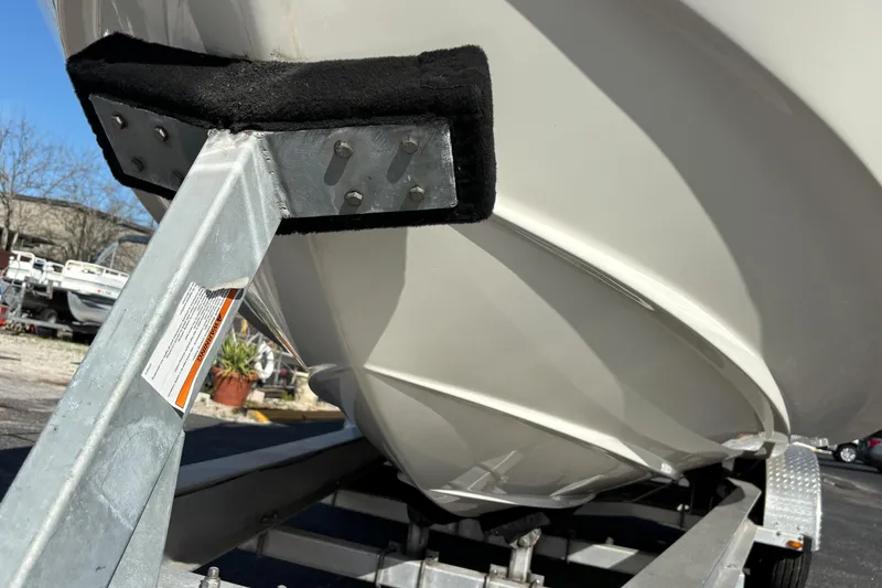 Slide: The Image of 2005 Regal Commodore 2765 boat on trailer, close-up of hull and support. - 10