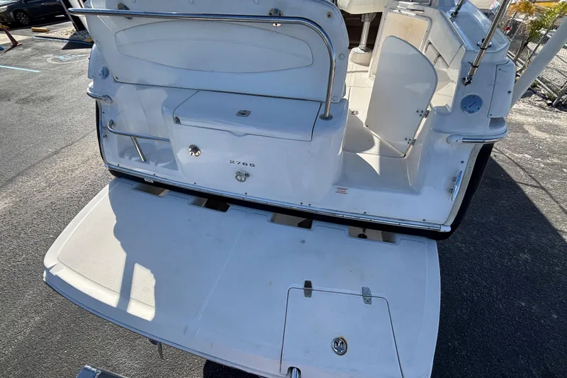 Slide: The Image of 2005 Regal Commodore 2765 boat stern view with open swim platform. - 11