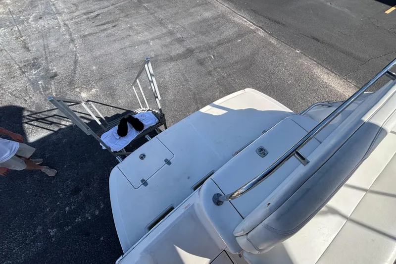 Slide: The Image of 2005 Regal Commodore 2765 boat with ladder and towel on deck. - 14