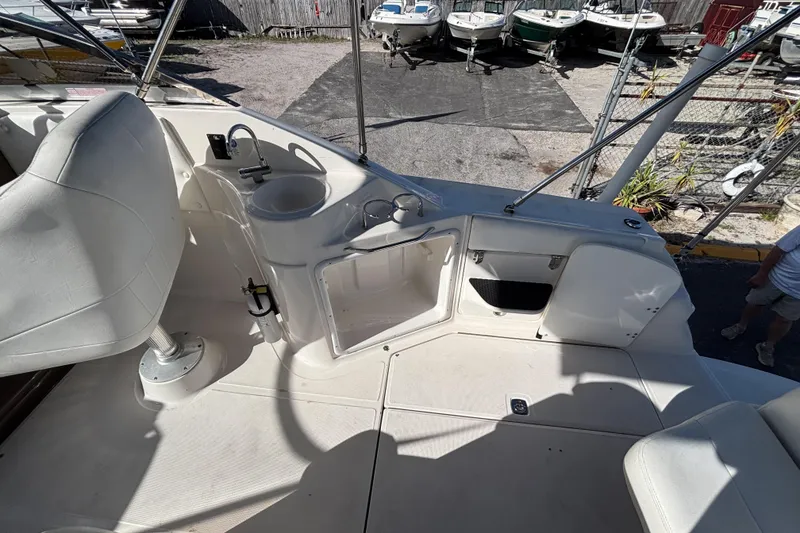 Slide: The Image of 2005 Regal Commodore 2765 boat interior with seating and sink area. - 17