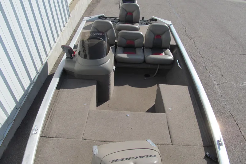 Slide: The Image of 1998 Tracker Pro Team 185 boat interior with seating and console. - 10