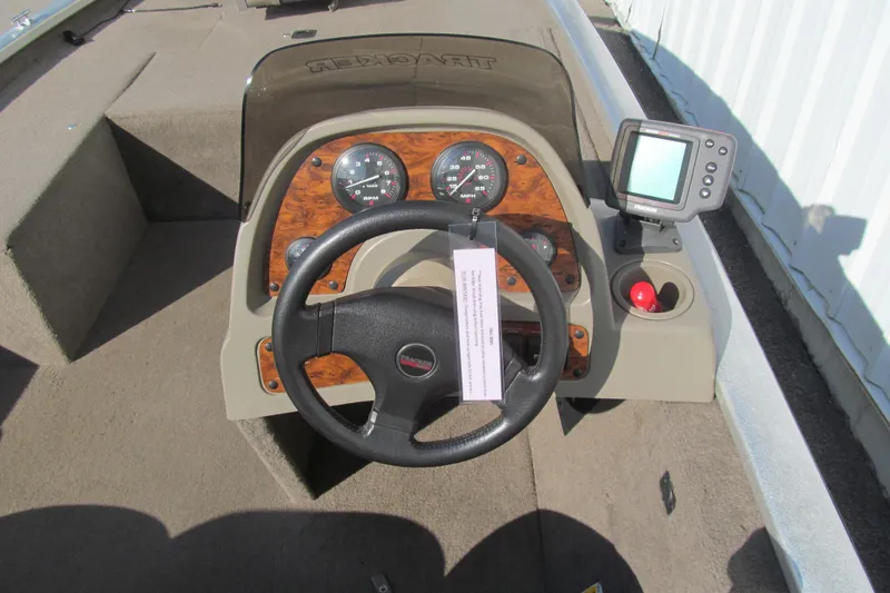 Slide: The Image of 1998 Tracker Pro Team 185 boat dashboard with steering wheel and gauges. - 6