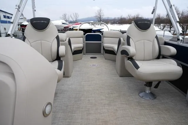 Slide: The Image of 2022 South Bay 222RS LE pontoon boat interior with plush seating and spacious layout. - 11