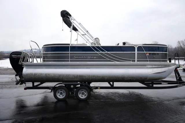Slide: The Image of 2022 South Bay 222RS LE pontoon boat on trailer, side view. - 4