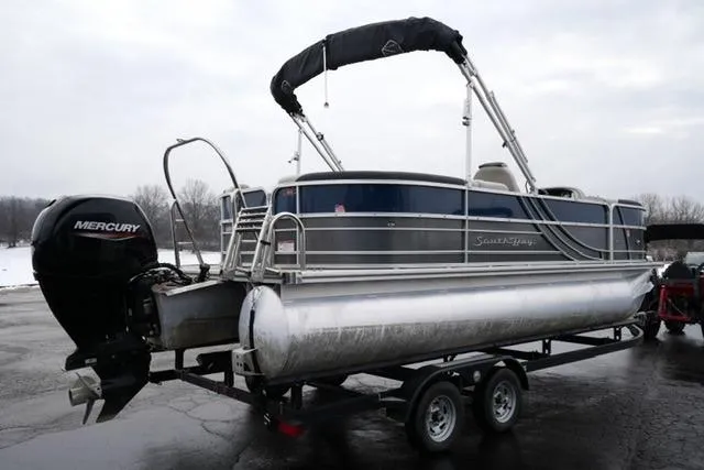 Slide: The Image of 2022 South Bay 222RS LE pontoon boat on trailer with Mercury outboard motor. - 5