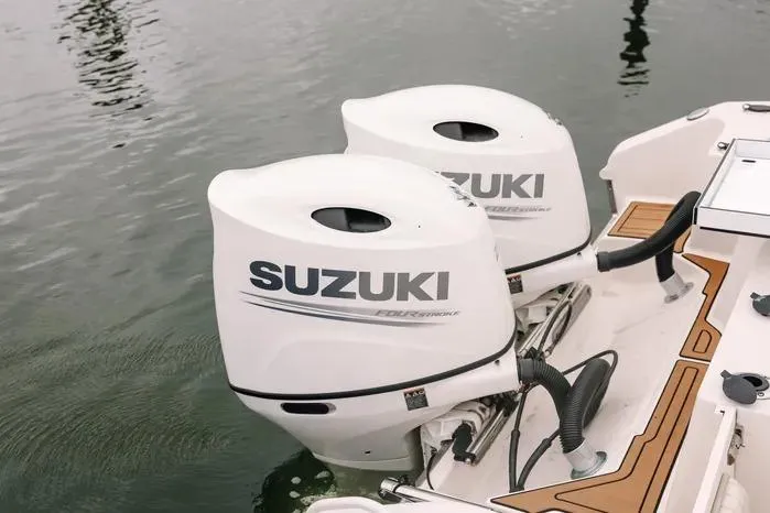 Slide: The Image of 2019 Carolina Skiff 27' Center Console with twin Suzuki outboard motors. - 3