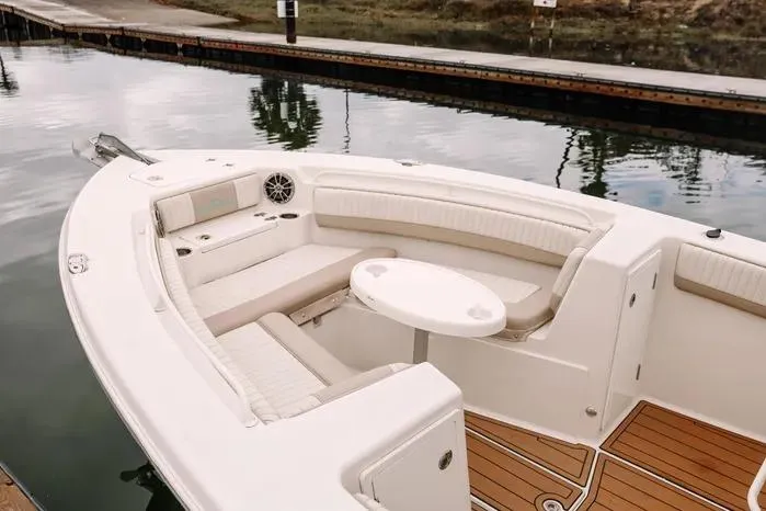 Slide: The Image of 2019 Carolina Skiff 27' Center Console boat with spacious seating and elegant design. - 7