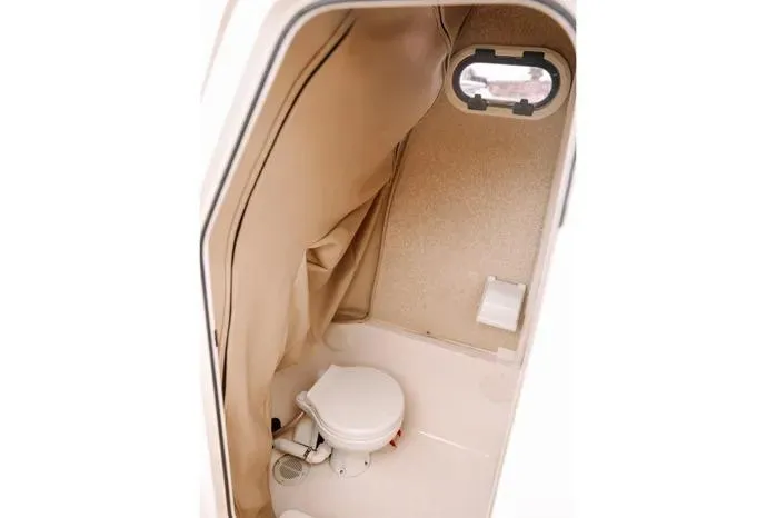 Slide: The Image of Interior of 2019 Carolina Skiff 27' Center Console boat with compact marine toilet. - 8