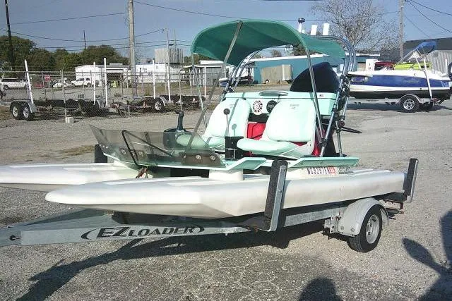 Slide: The Image of 2021 CraigCat E2 Elite on EZ Loader trailer, parked outdoors. - 3