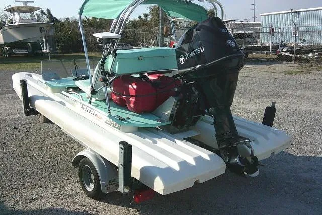 Slide: The Image of 2021 CraigCat E2 Elite with Tohatsu motor on trailer, parked outdoors. - 7