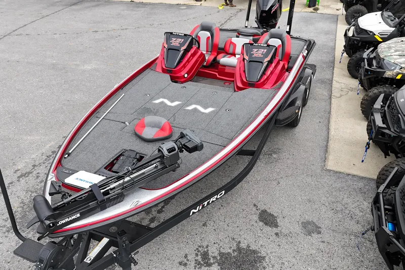 Slide: The Image of 2025 Nitro Z21 XL Pro bass boat with red and gray design on display. - 2