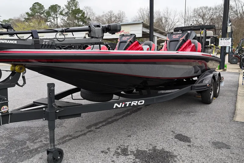 Slide: The Image of 2025 Nitro Z21 XL Pro boat on trailer, featuring sleek design and red accents. - 3