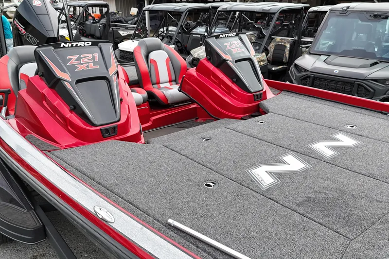 Slide: The Image of 2025 Nitro Z21 XL Pro boat with red accents and spacious deck. - 5