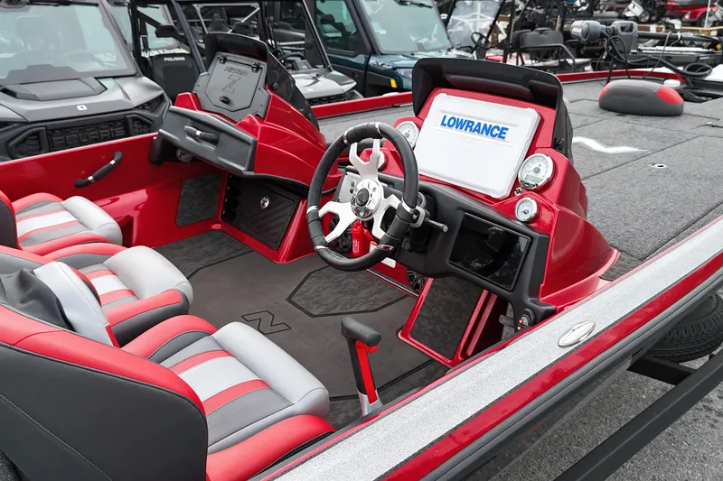 Slide: The Image of 2025 Nitro Z21 XL Pro boat interior with red and gray seating, steering wheel, and Lowrance display. - 6