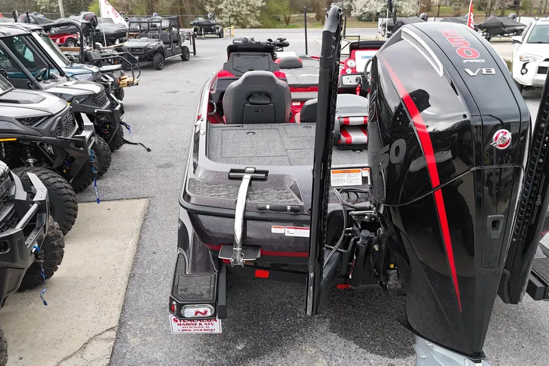 Slide: The Image of 2025 Nitro Z21 XL Pro boat with V8 engine, displayed in a dealership lot. - 9