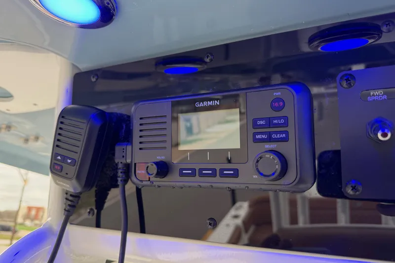 Slide: The Image of Garmin marine radio on 2026 Sea Hunt Ultra 285 SE boat dashboard. - 19