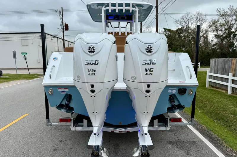 Slide: The Image of 2026 Sea Hunt Ultra 285 SE boat with dual Yamaha V6 4.2L engines. - 3