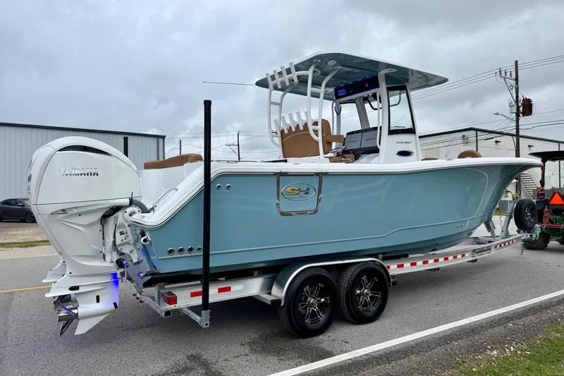 Slide: The Image of 2026 Sea Hunt Ultra 285 SE boat on trailer, featuring Yamaha outboard engine. - 4