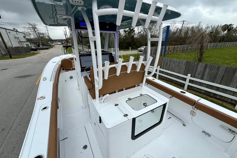 Slide: The Image of 2026 Sea Hunt Ultra 285 SE boat interior with rod holders and seating. - 8