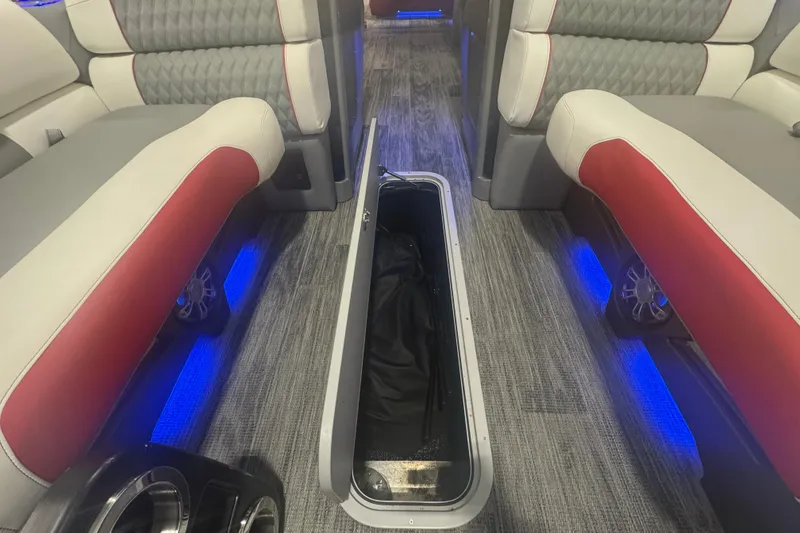 Slide: The Image of 2025 Avalon Catalina Cruise interior with storage compartment, blue LED lighting, and stylish seating. - 10
