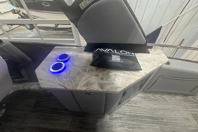 Slide: The Image of 2025 Avalon Catalina Cruise interior with illuminated cup holders and stylish marble countertop. - 12