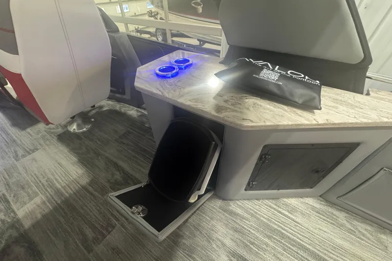 Slide: The Image of 2025 Avalon Catalina Cruise interior with rear bench, illuminated cup holders, and storage compartments. - 13